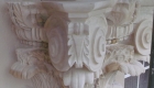 Banker carving stone capital